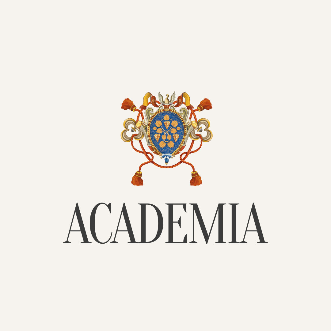 Logo von Academia, bestehend aus einem Wappen mit blauer Mitte, goldenen Verzierungen und roten Quasten, unter dem Schriftzug 'ACADAMIA' in großer, schwarzer Schrift.