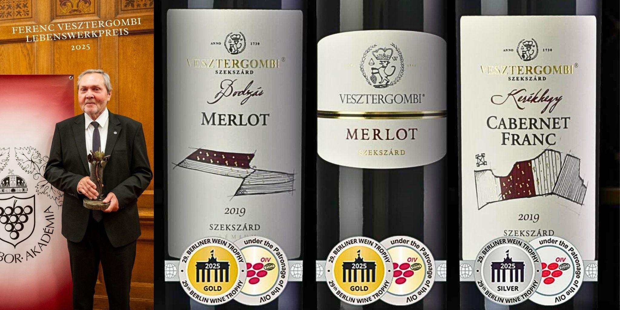 Mann in Anzug hält eine Trophäe vor einer roten Wand mit Text 'Ferenc Vesztergombi Lebenswerkpreis 2025'. Drei Weinflaschen mit Etiketten 'Vesztergombi Szekszárd', Sorten Merlot und Cabernet Franc, Jahrgang 2019, mit Medaillen für Gold und Silber.